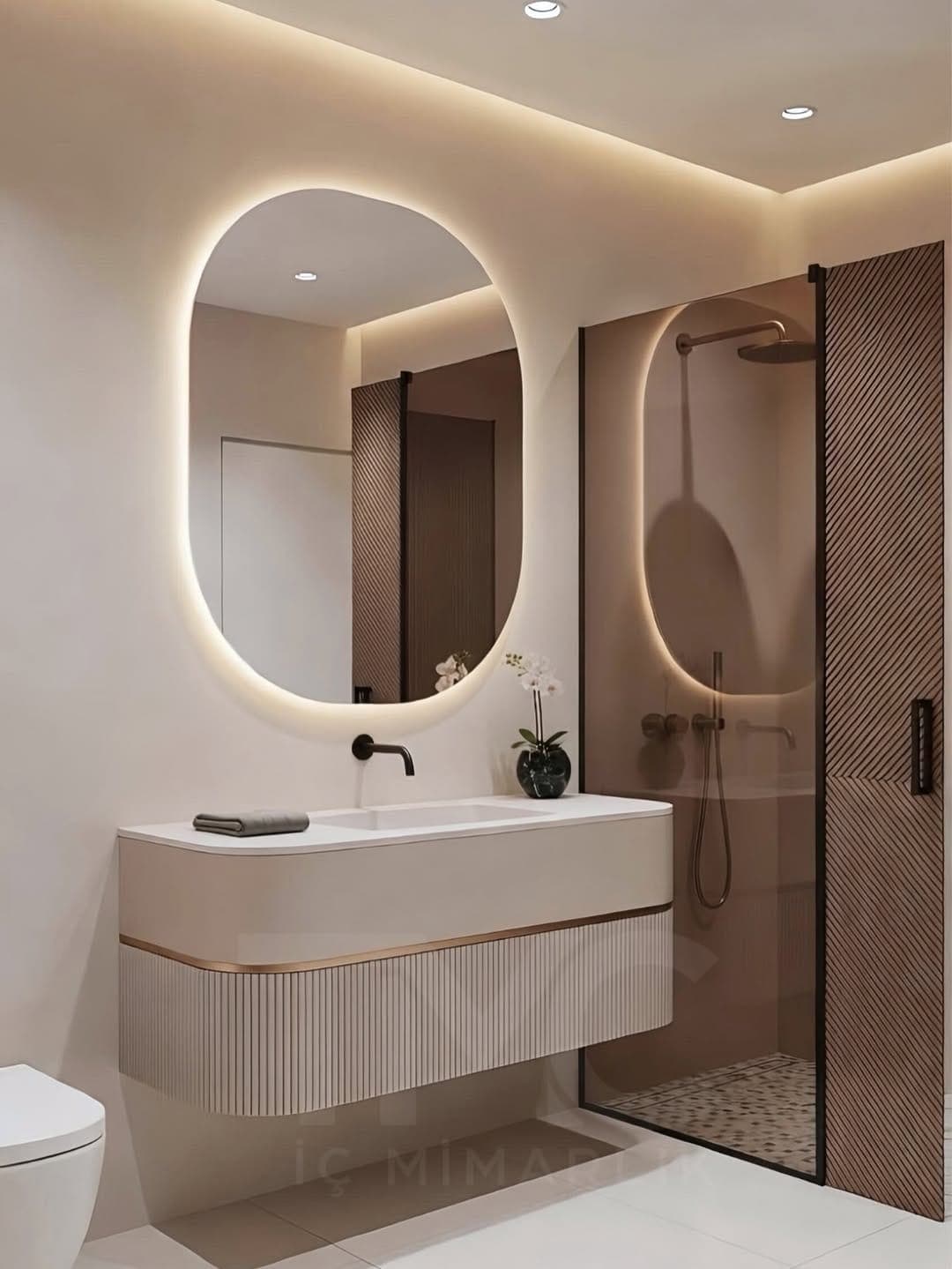 Modern Banyo Tasarımı | Oval LED Ayna, Nervür Cam ve Soft Bej Tonlar genel mimari perspektifi ve ana mobilya görünümü